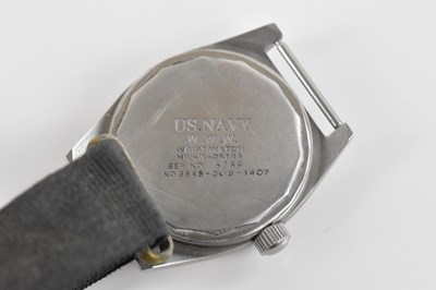 Lot 1879 - US NAVY; a manual wind wristwatch, the black...