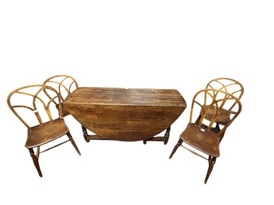 Lot 205 - An 18th century oak drop-leaf gateleg dining...