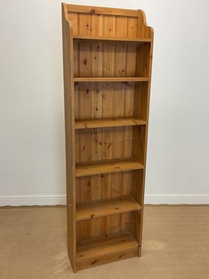 Lot 867 - A reproduction pine open book case with five...