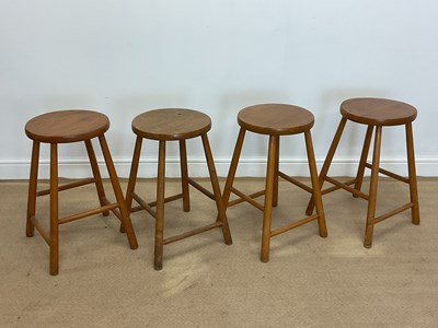 Lot 868 - A set of four reproduction pine kitchen stools,...