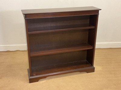 Lot 869 - A reproduction mahogany open bookcase with two...