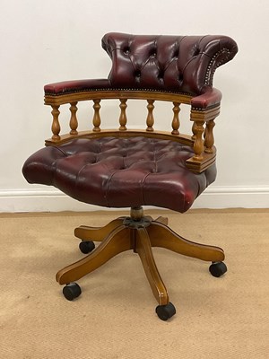 Lot 863 - A reproduction captain's chair with leather...