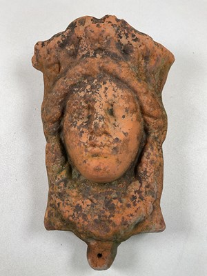 Lot 750 - A terracotta wall mounted planter in the form...