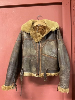 Lot 86 - A vintage sheepskin flying jacket. Proceeds to...