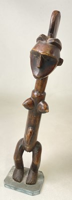 Lot 80 - A 20th century carved African tribal figure of...