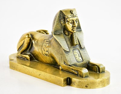 Lot 782 - A brass sculpture of a sphinx, height 30cm.