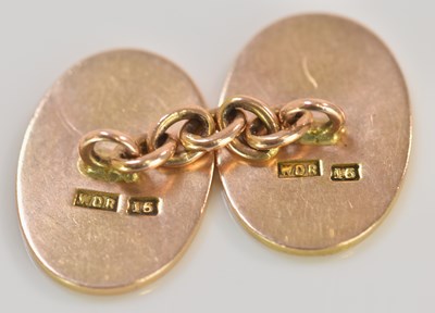 Lot 557 - A pair of 15ct yellow gold cufflinks, each...