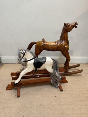 Lot 118 - A wooden rocking horse, with carved decoration,...