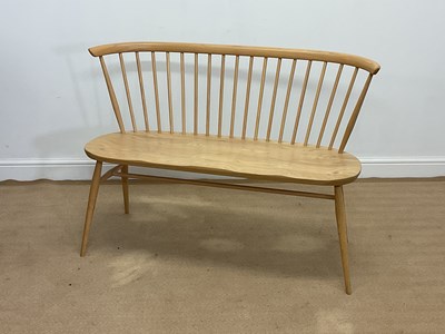 Lot 757 - ERCOL; an oak Heritage Loveseat, height 84cm,...