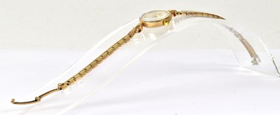 Lot 1136 - OMEGA; a 9ct yellow gold cased ladies' quartz...