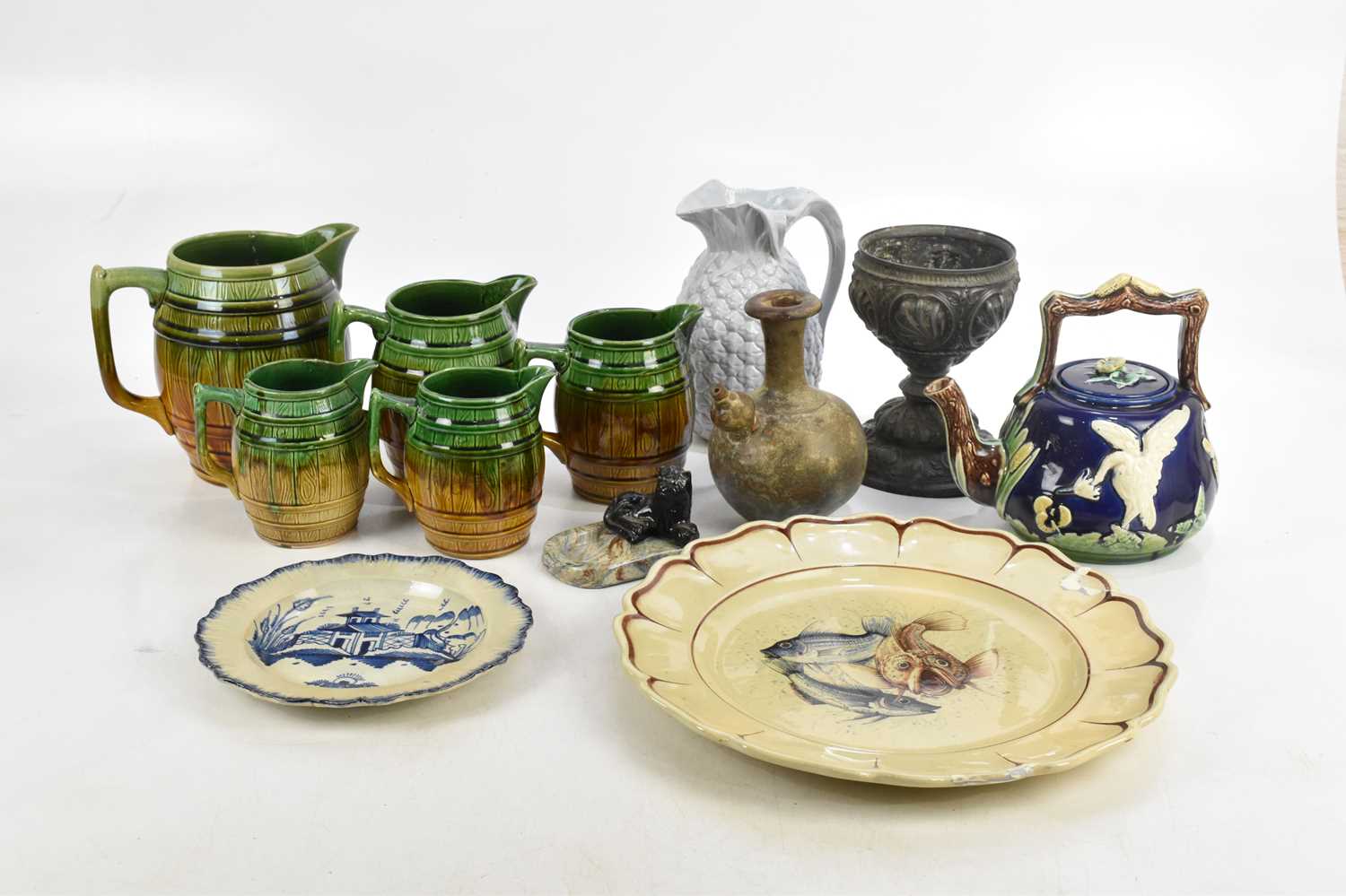 Lot 650 - A Victorian majolica teapot, relief decorated...