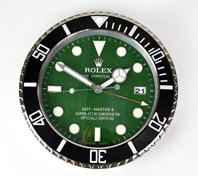 Lot 143 - A “Rolex” dealer's display wall clock modelled...