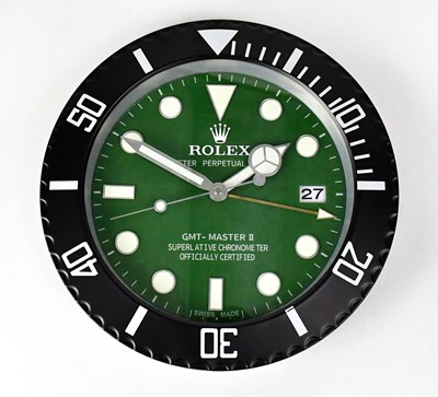 Lot 145 - A “Rolex” dealer's display wall clock modelled...