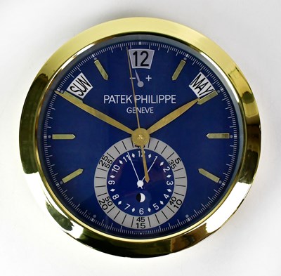 Lot 146 - A “Patek Philippe” dealer's display wall clock,...