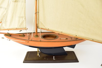 Lot 434 - A vintage pond yacht with three canvas sails,...