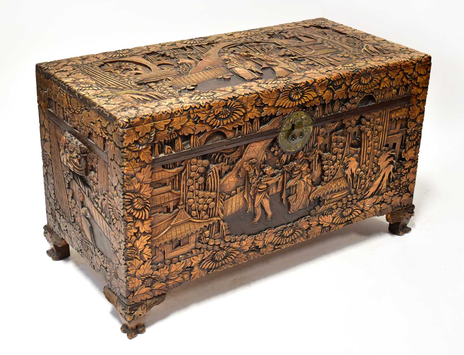 Lot 47 - A Chinese carved camphorwood chest, with...