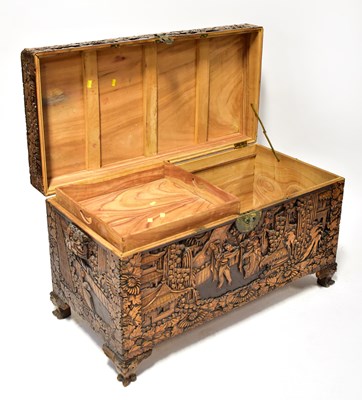 Lot 47 - A Chinese carved camphorwood chest, with...