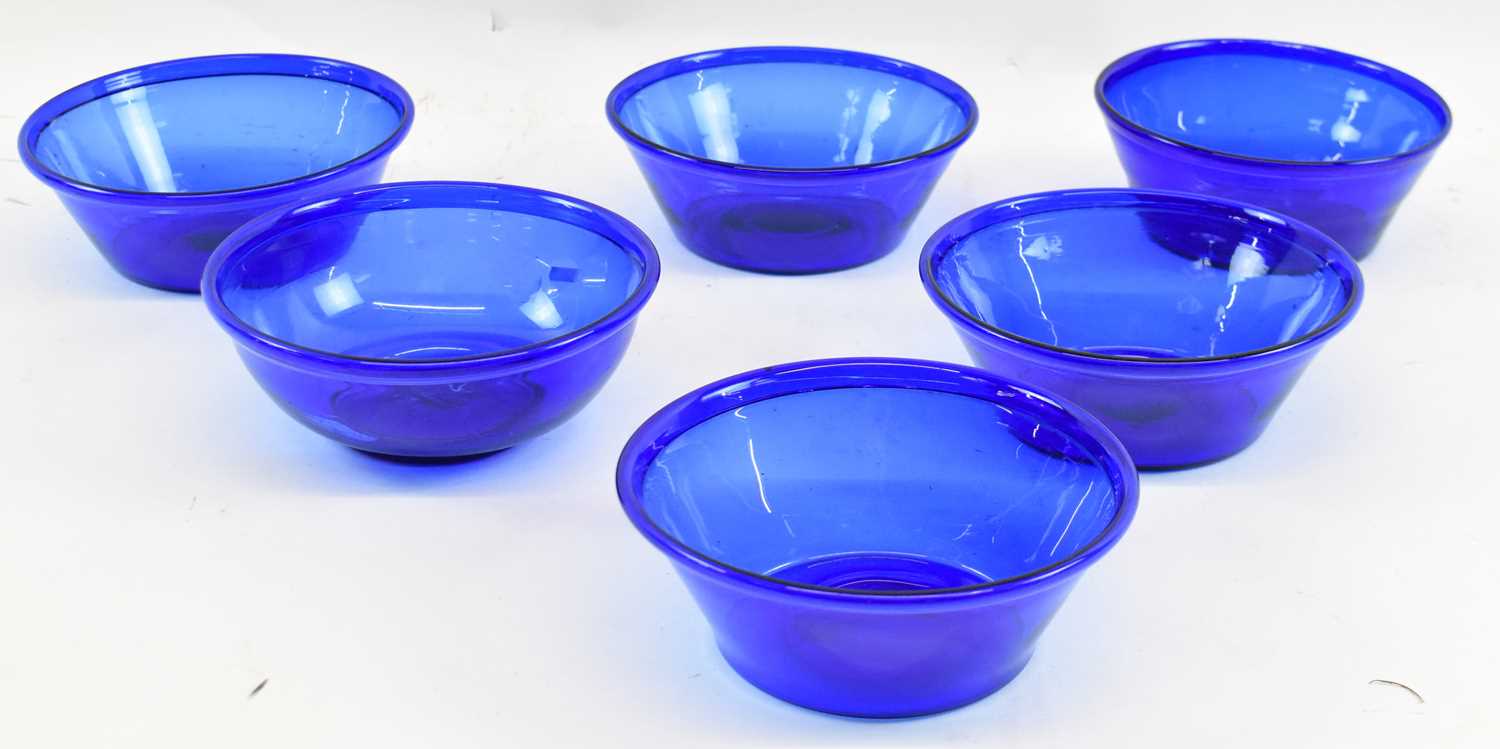 Lot 632 - A set of five blue glass bowls, and another...