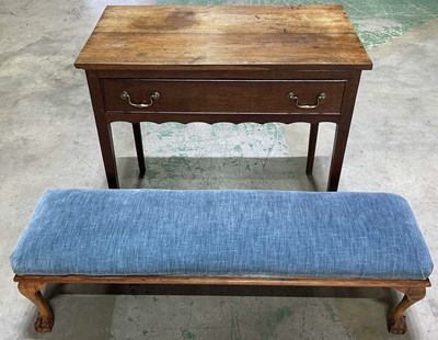 Lot 828 - An oak desk with fitted brass handles to...