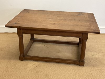 Lot 848 - An oak coffee table with ground level...