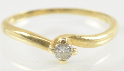 Lot 900 - An 18ct gold small diamond solitaire ring,...