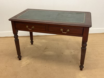 Lot 847 - A mahogany leather top writing table, height...