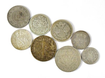 Lot 1053 - Eight world coins, to include a Portuguese...