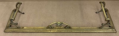 Lot 143 - An Art Nouveau brass fender, 132 x 36cm.