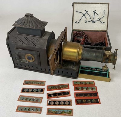 Lot 55 - A vintage magic lantern with metal plate...