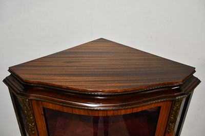 Lot 32 - A reproduction serpentine fronted vitrine with...