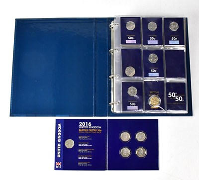 Lot 1024 - A folder containing a variety of 50p and £2...