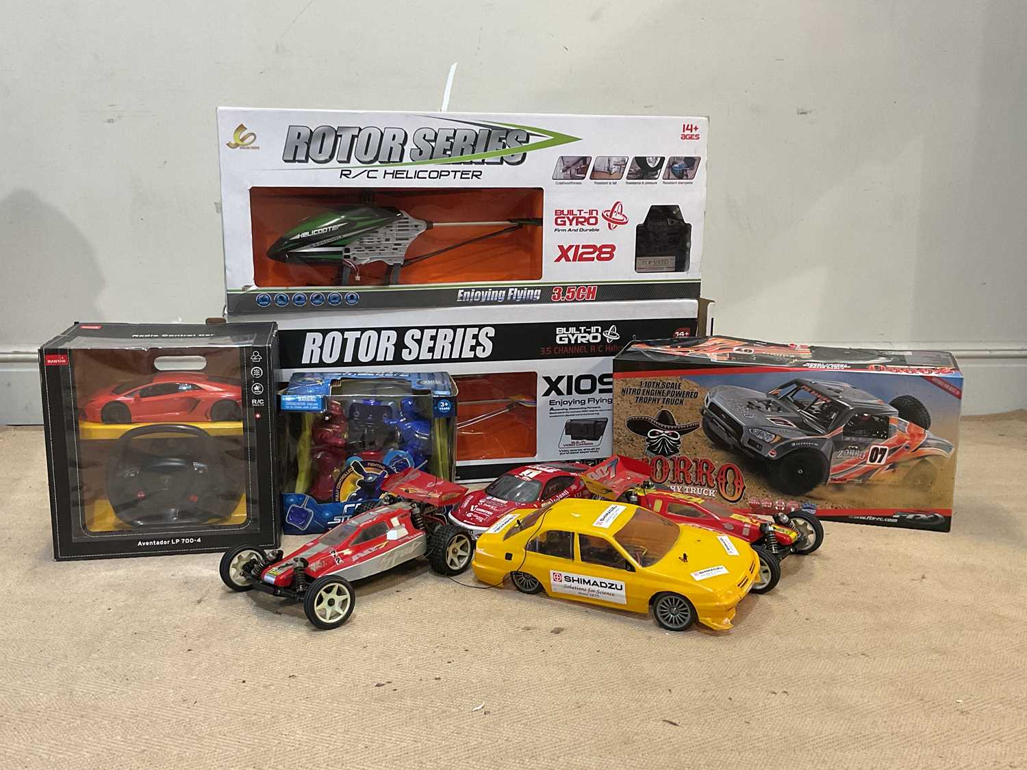 Lot 110 - A collection of remote control vehicles,