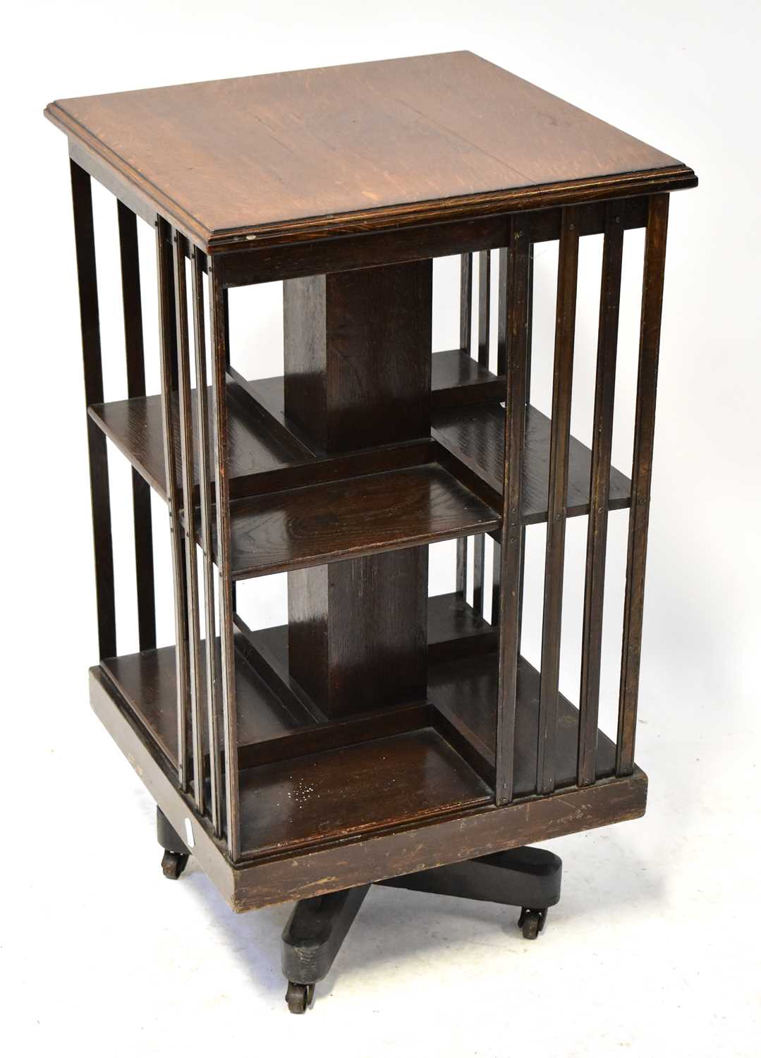 Lot 46 - An Edwardian oak revolving bookcase, to...