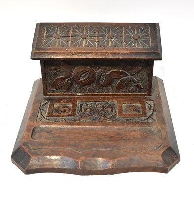 Lot 525 - A Victorian oak desk tidy, with hinged lidded...