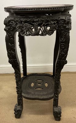 Lot 261 - A Chinese carved hardwood jardinière stand,...