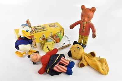 Lot 954 - A vintage cased Pelham puppet, a Walt Disney...