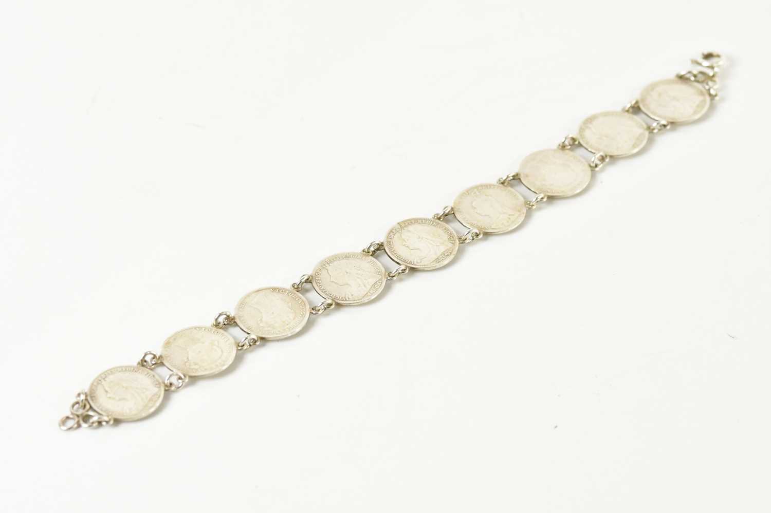 Lot 1769 - A bracelet formed of threepenny bit coins, all...