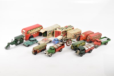 Lot 896 - MINIC; a collection of tinplate toys including...