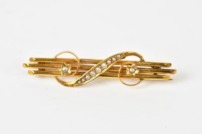 Lot 1255 - A 9ct yellow gold seed pearl set bar brooch,...