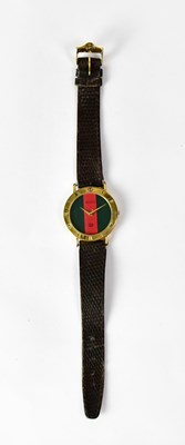 Lot 828 - GUCCI; a ladies' wristwatch, the case with...