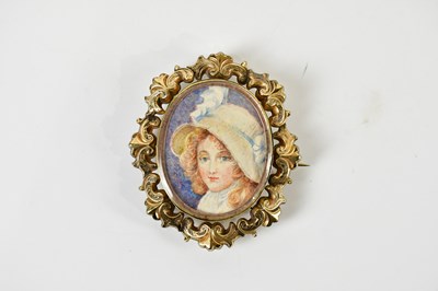 Lot 1237 - A Victorian yellow metal framed oval portrait...