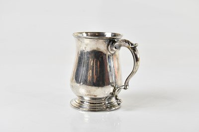 Lot 342 - A George III hallmarked silver baluster mug,...