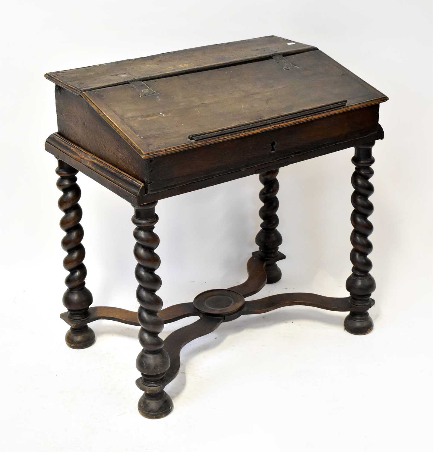 Lot 26 - An 18th century oak clerk's desk on stand, the...