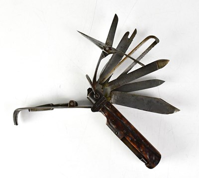 Lot 569 - A late 19th/early 20th century multi-tool with...