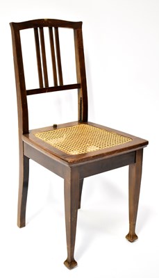 Lot 56 - An Edwardian mahogany bergère seated...