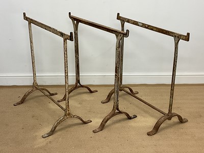 Lot 727 - Three early 20th century forged iron trestles,...