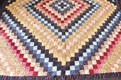 Lot 613 - A patchwork quilt made of small squares, with...