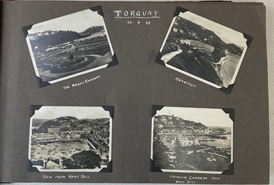 Lot 282 - An oblong photograph album containing one...