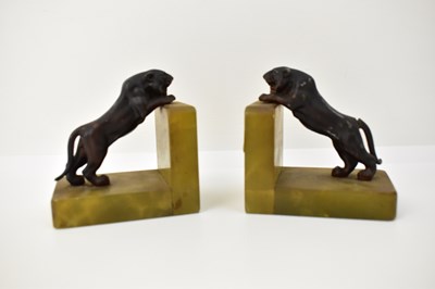 Lot 544 - A pair of Art Deco onyx bookends, with bronzed...