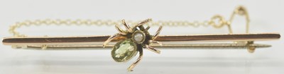 Lot 942 - A 9ct gold bar brooch, with a spider to the...